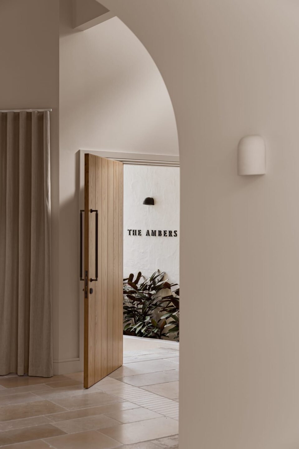 The Ambers Home by Jenn Bliss features the Berlin Pull Handle in Signature Brass on the home's front door.